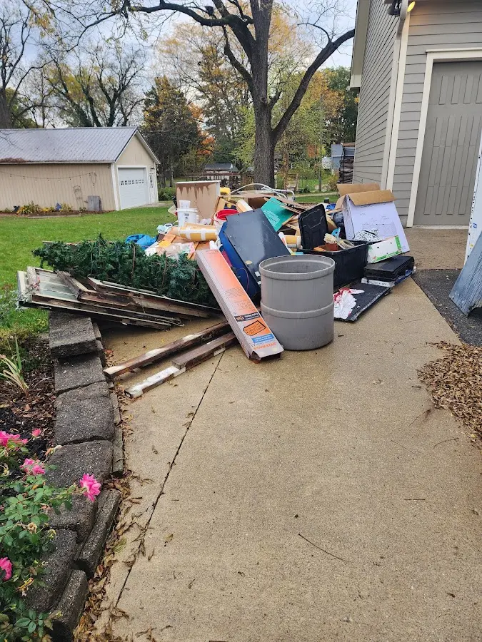 Dumpster being loaded with debris for Roofing Dumpster Rental in Vero Beach South